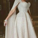 لباس عروس کلوش با کار دست و آستین‌های بلند